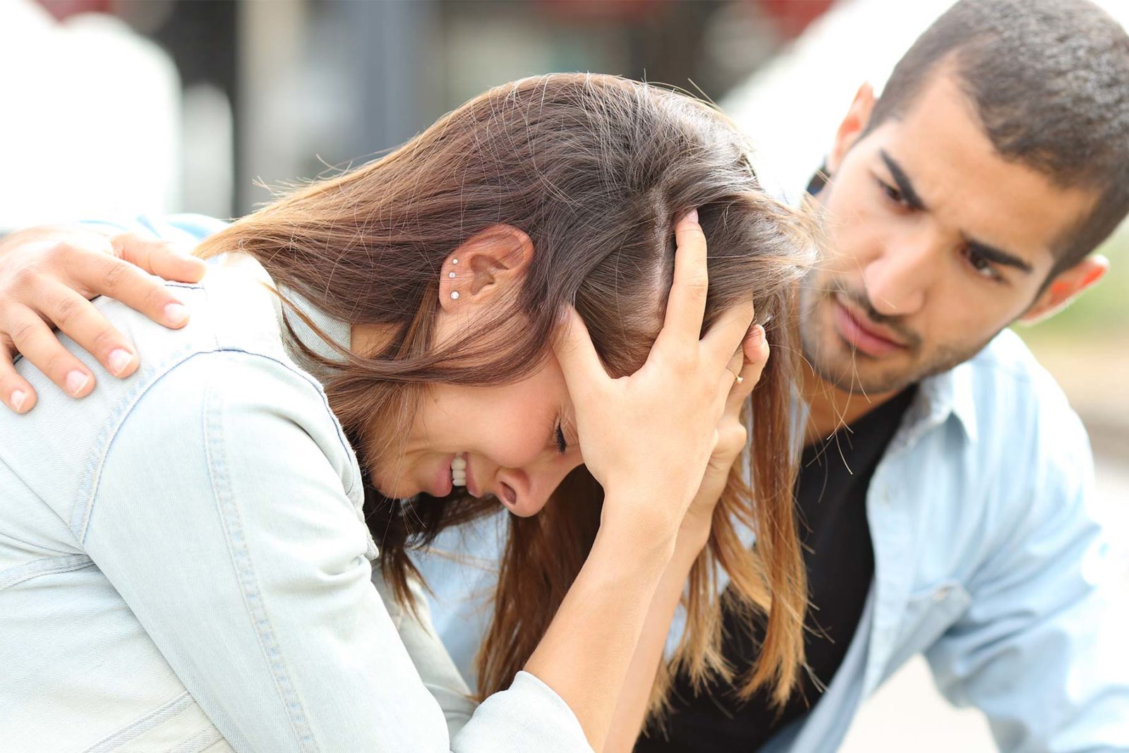 Man comforting a woman