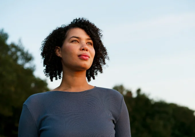 Woman looking contemplative, gazing into the distance