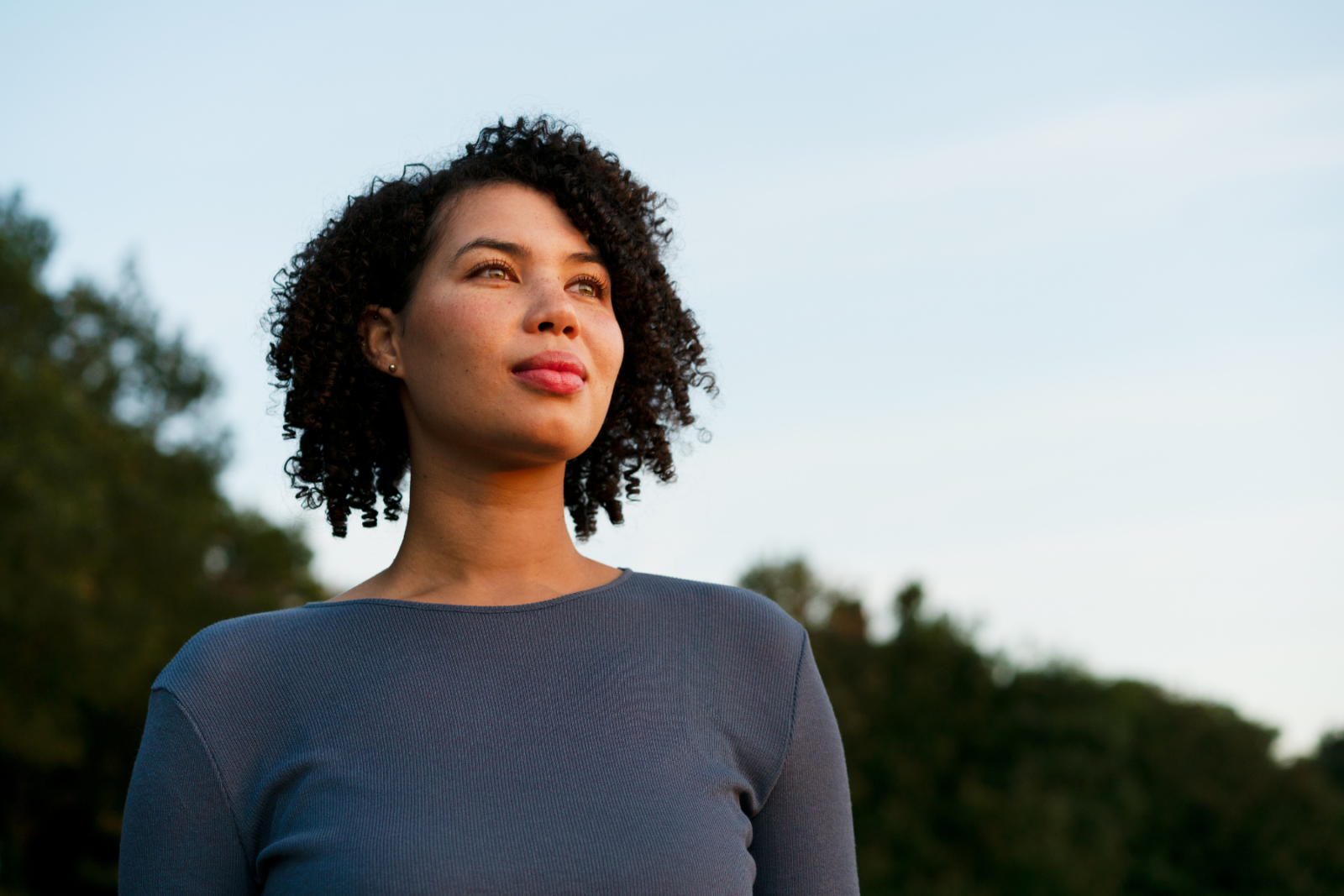 Woman looking contemplative, gazing into the distance